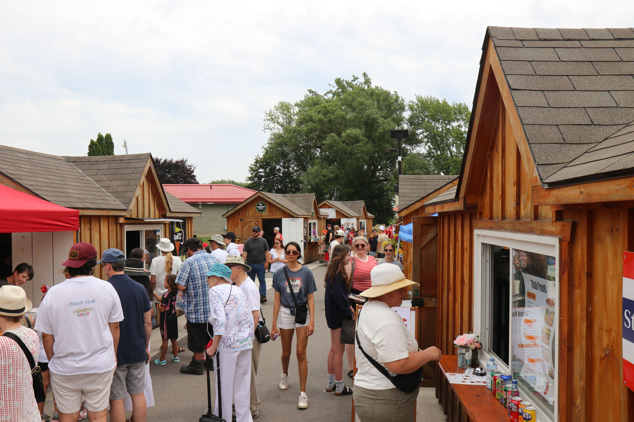 People browsing local food and market cabins at the Quinte West pop-ups